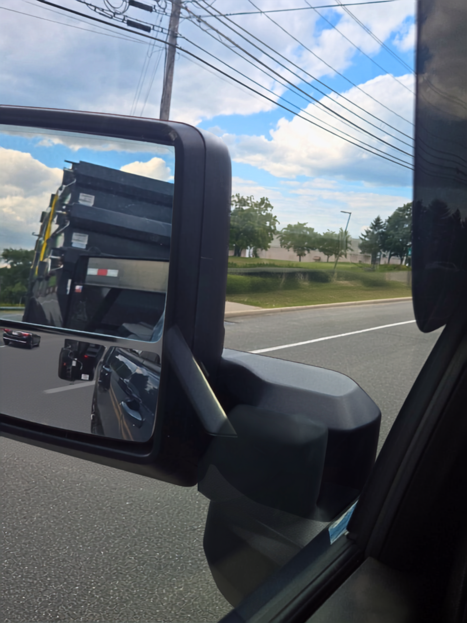 Dumpsters in the rearview mirror